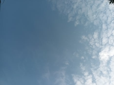 Clear blue with scattered clouds photo