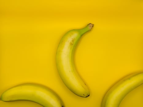 Concept art of three bananas in the center of the image, top view photo