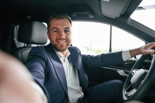 Businessman ,is in the brand new car photo