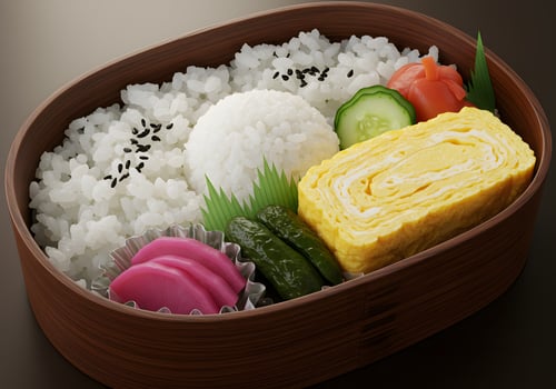 Traditional japanese bento box with rice omelet and pickled vegetables photo