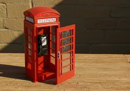 Bright red telephone booth with open door overhead view conceptual shot photo
