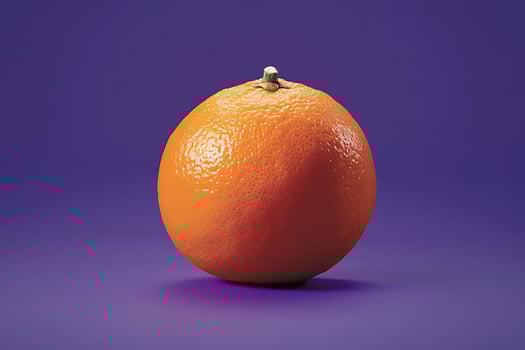 Orange fruit on violet purple backdrop photo