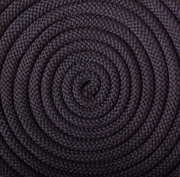 black textured cord laid in a spiral, circular pattern photo