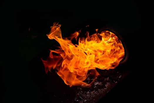 Burning flame or fire isolated on black background photo