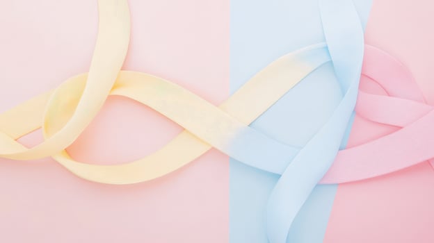Colorful ribbons intertwined on soft background photo