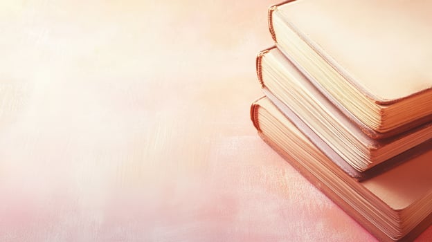 Stacked books on a pastel background in soft light photo