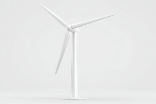 A white wind turbine model stands prominently against a plain background, showcasing its three blades. This representation highlights the focus on renewable energy and sustainability. photo