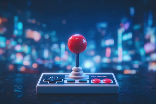 A classic arcade joystick with a bright red ball lever sits on a dark surface, illuminated by colorful city lights in the background. The atmosphere evokes nostalgia for retro gaming. photo