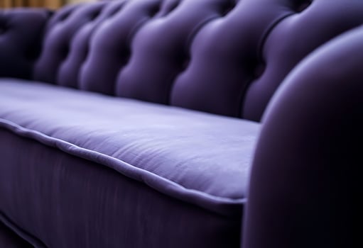 close up of a purple couch with buttons photo