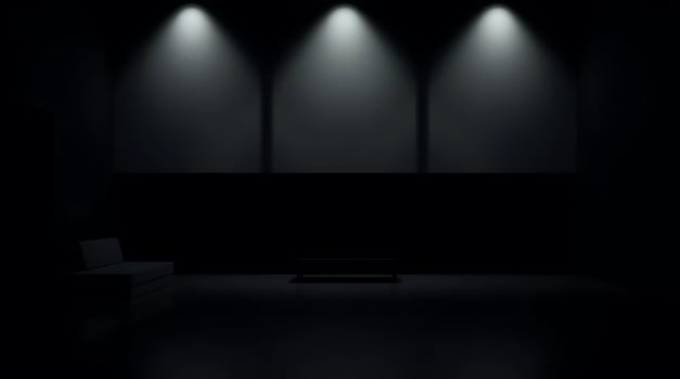 Minimalist interior design with spotlights illuminating a stark, modern living room. photo