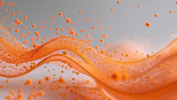 Orange liquid flowing over a white background photo