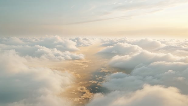a illuminated scene over a valley of clouds, where the sky meets the earth in a blur of white and gold photo