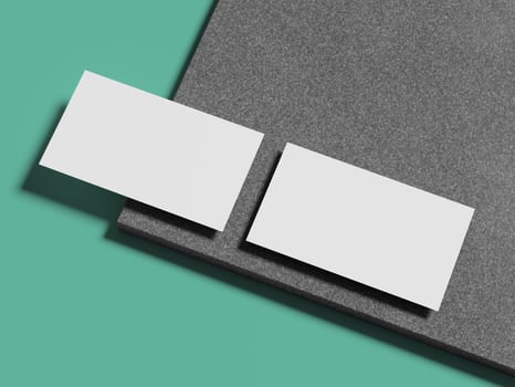Two pristine white business cards arranged on a polished marble surface, offering a timeless and sleek appearance. photo