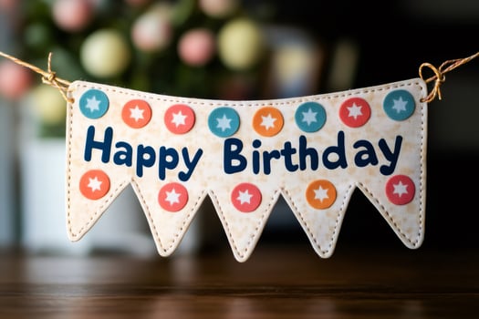 Happy birthday banner hanging with colorful dots and stars photo