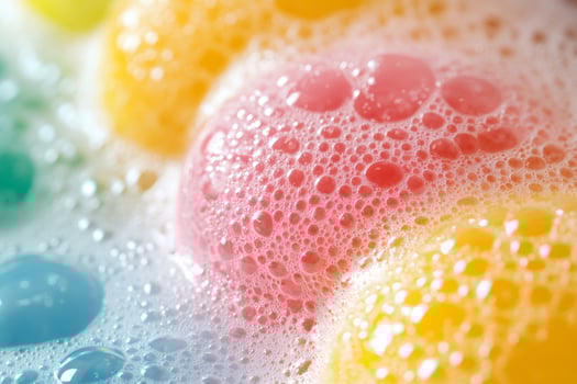 Colorful soapy balls creating foam and bubbles photo