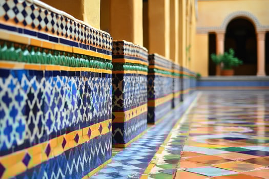Colorful moroccan tiles decorating walls and floor in traditional courtyard photo