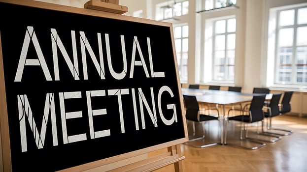 Annual Meeting Announcement on Blackboard in Bright Conference Room photo