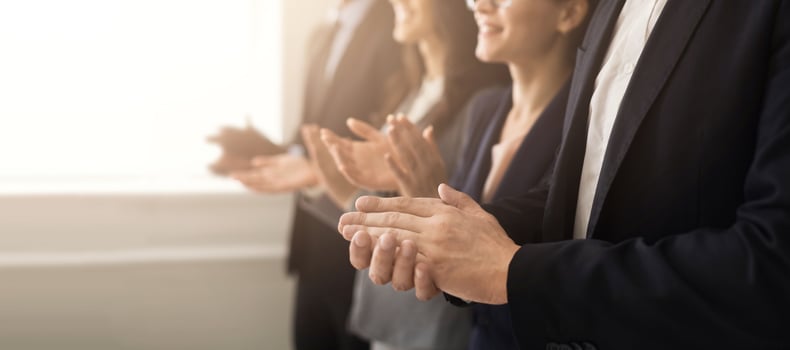 Closeup of business people hands clapping at conference photo