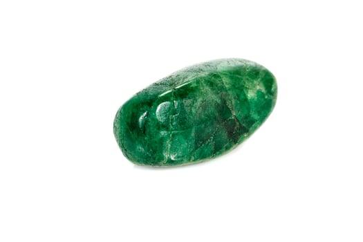 Macro stone garnet mineral, Uvarovite, in rock on a white background photo