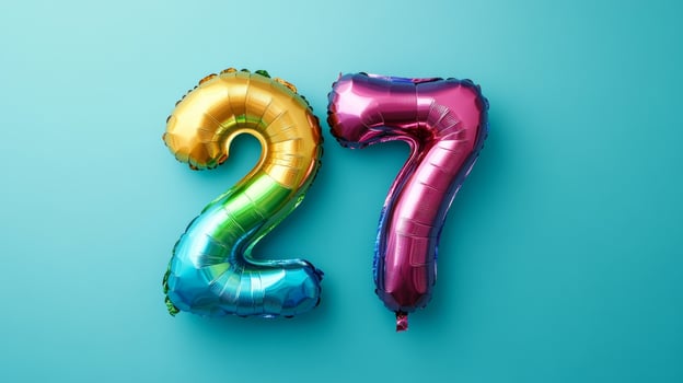Colorful rainbow foil balloon displaying the number twenty-seven on a vibrant blue background, perfect for birthdays or celebrations photo