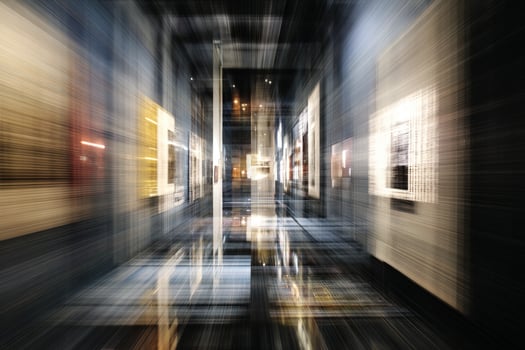 Dynamic motion blur effect in a corridor filled with illuminated artworks. The blurred lines create a sense of speed and modernity, enhancing the visual intensity photo