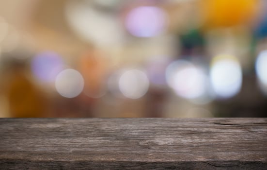 wooden table top with blurred bar counter background photo