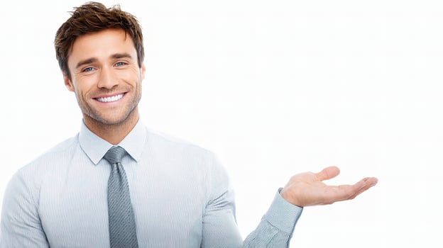 A man in a shirt and tie is holding something photo