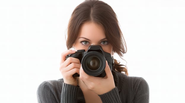 A woman taking a picture with a camera photo