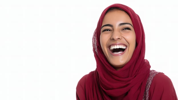 A woman in a red hijab is laughing photo