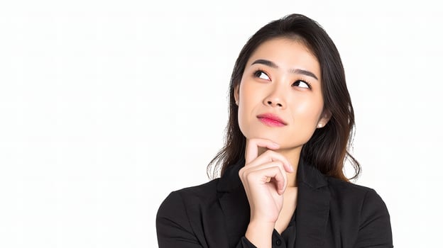 A woman in a black suit is thinking photo