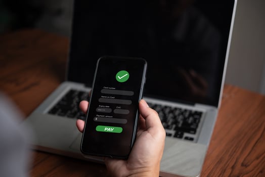 A person using a smartphone to login to a website photo
