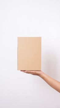 Close up of hand with package box parcel isolated on white background photo