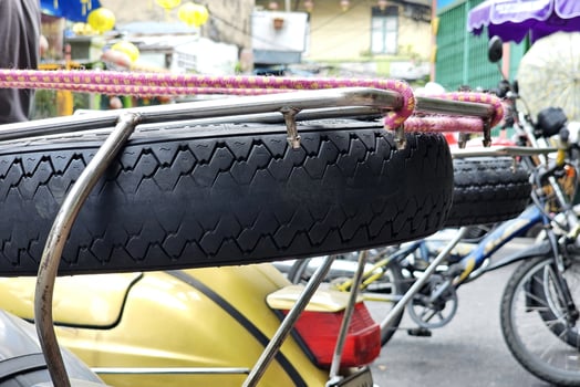 Spare Tires Attached to the back of Scooters. photo