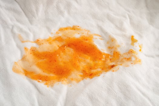 Dirty tomato sauce stain on cloth photo