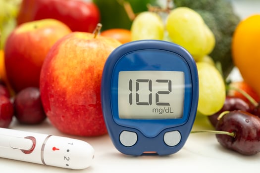 digital glucose monitor measure with vegetable and fruit healthy food. photo