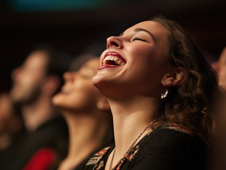 Audience member enjoys a performance with joy and enthusiasm photo