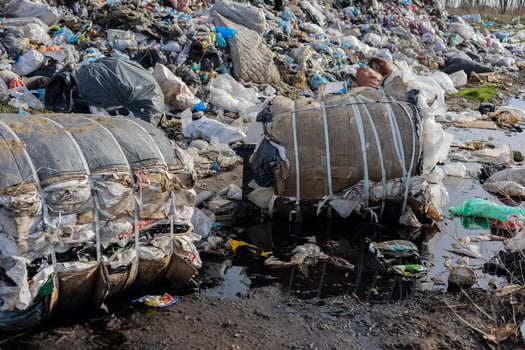 Large piles of waste and discarded materials fill the landscape, highlighting the pressing issue of pollution and improper waste management photo
