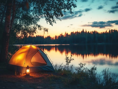 Peaceful camping by the lake at sunset in the wilderness photo