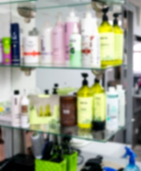 Blurred image of hair care products in a hair salon. Safe haircare concept. photo