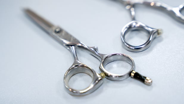 Hairdressing scissors on the table. Close-up. Selective focus. photo