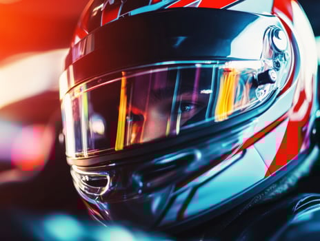 Racer in helmet prepares for competition on racetrack photo