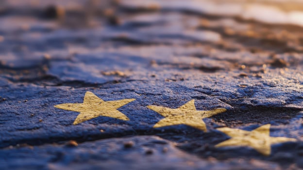 European flag stars on weathered surface at sunset photo