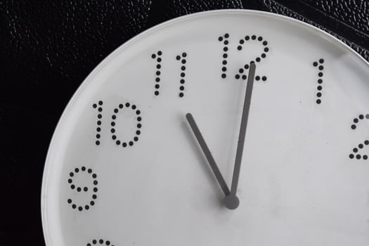 Focus time in clock of eleven o'clock for design in your business concept isolated on black background photo