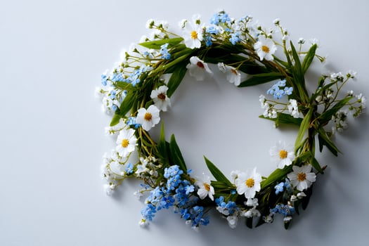 Wreath of forget me not flowers on white background photo
