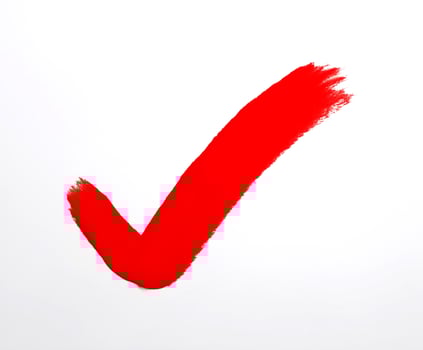 Bold red checkmark on white background, symbolizing approval. photo