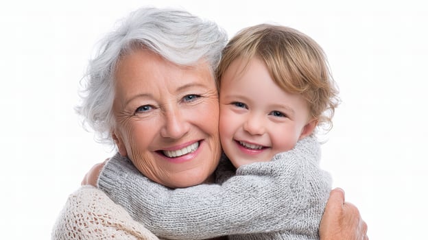 An older woman and a young child hugging photo