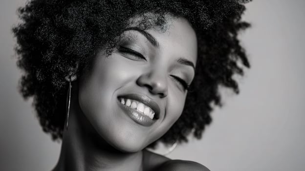 A black and white photo of a woman with an afro