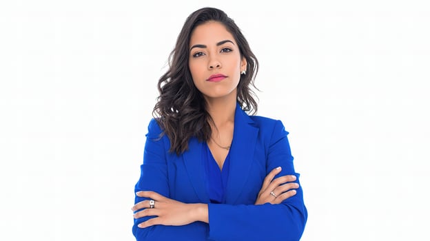 A woman in a blue suit with her arms crossed photo
