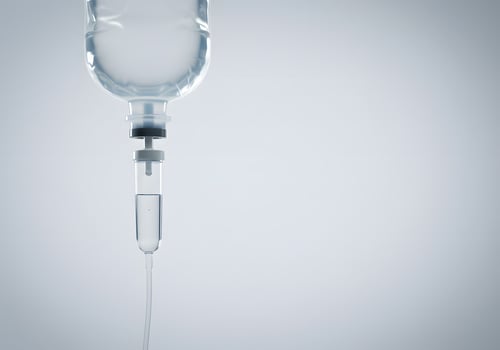 Intravenous fluid bag and tubing photo