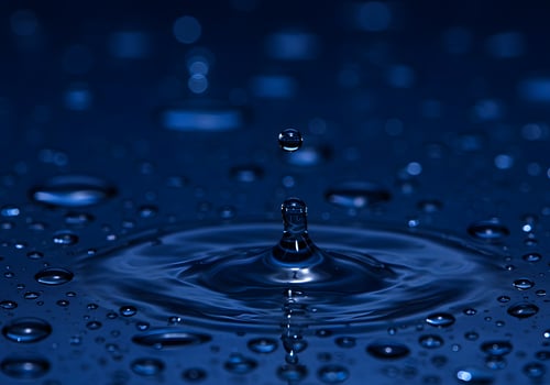 Water droplets on a blue background photo